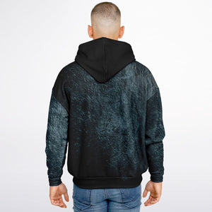 Person wearing a black and gray marbled hoodie on a white background