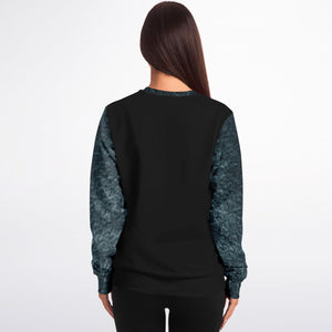 Person wearing a black outfit with blue sleeves on a white background